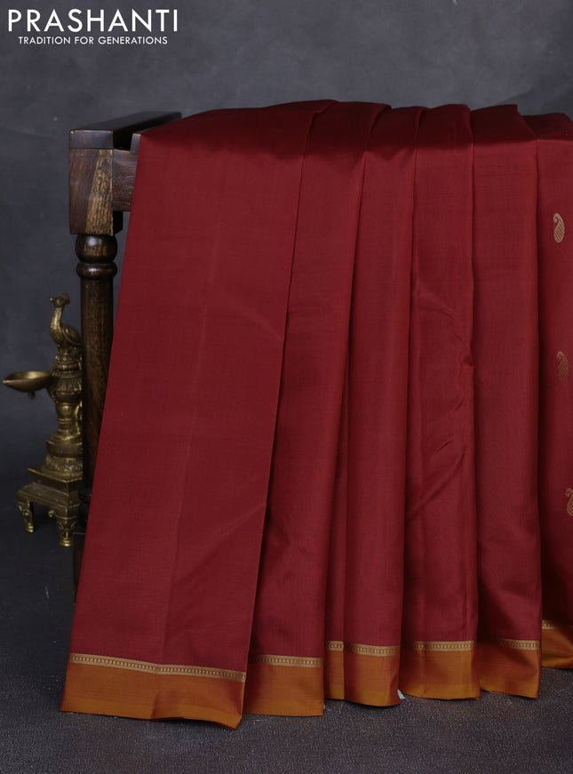 Pure kanchipuram silk saree maroon and mustard yellow with allover paisley zari woven buttas and zari woven simple border