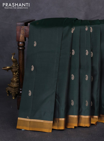 Pure kanchipuram silk saree bottle green and mustard yellow with allover zari woven buttas and zari woven simple border