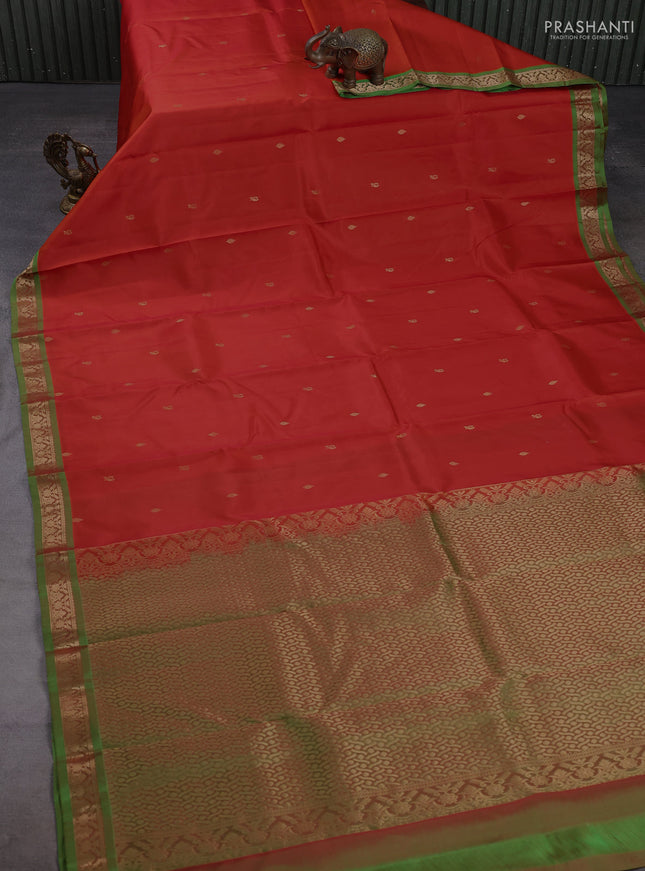 Pure kanchipuram silk saree orange and light green with zari woven buttas and small zari woven border
