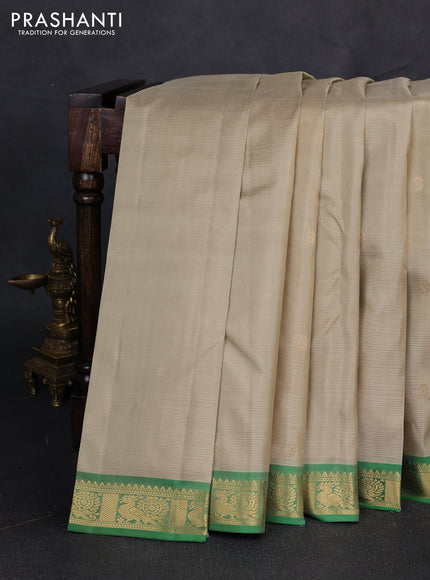 Pure kanchipuram silk saree pista green and green with zari woven buttas and zari woven border