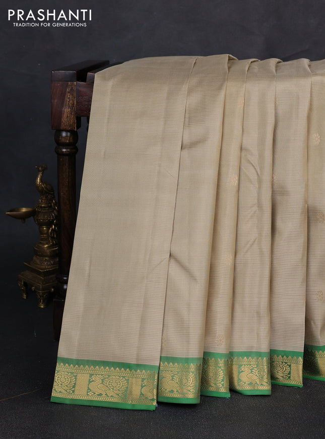 Pure kanchipuram silk saree pista green and green with zari woven buttas and zari woven border