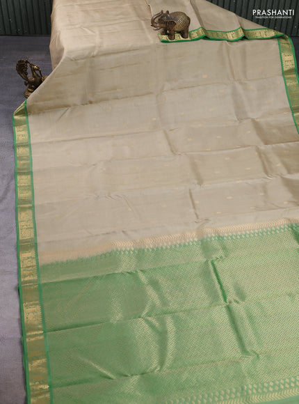 Pure kanchipuram silk saree pista green and green with zari woven buttas and zari woven border