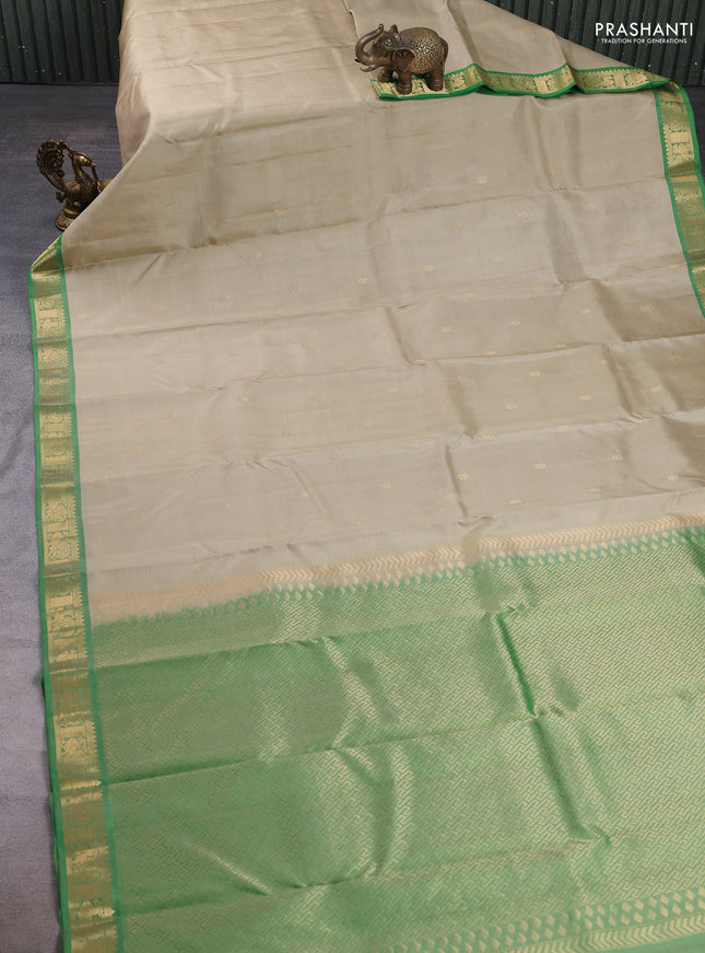 Pure kanchipuram silk saree pista green and green with zari woven buttas and zari woven border