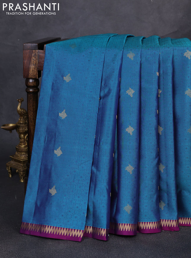 Pure kanchipuram silk saree peacock blue and purple with allover self emboss zari buttas and small zari woven border