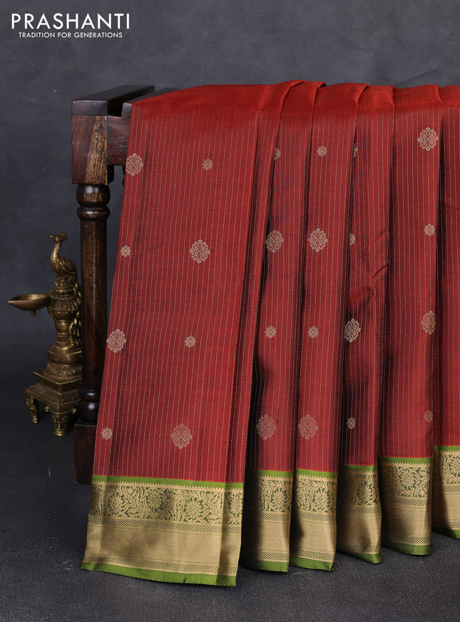 Pure kanchipuram silk saree rustic orange and light green with allover zari weaves & buttas and zari woven border