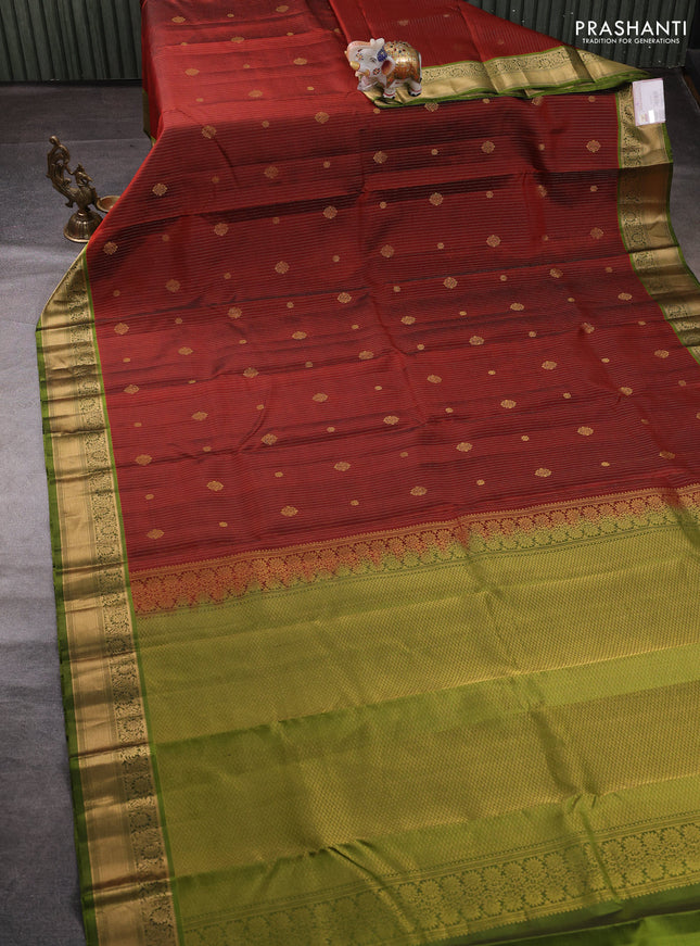 Pure kanchipuram silk saree rustic orange and light green with allover zari weaves & buttas and zari woven border