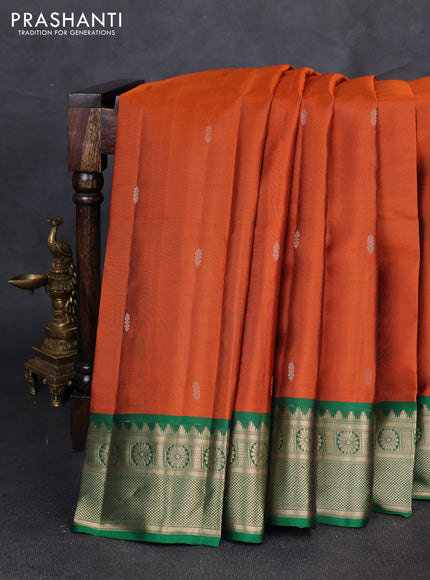 Pure kanchipuram silk saree rust shade and green with zari woven butttas and zari woven border