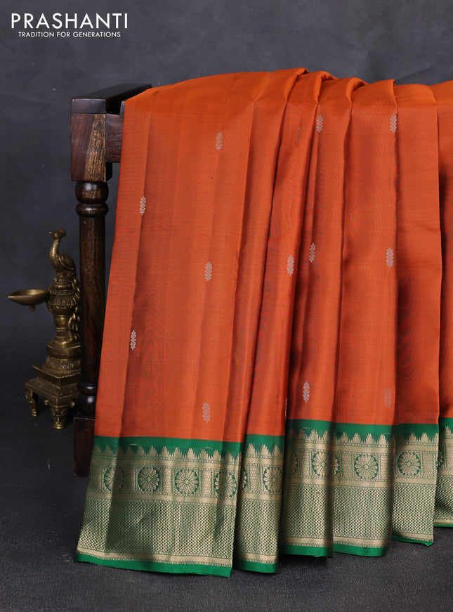 Pure kanchipuram silk saree rust shade and green with zari woven butttas and zari woven border