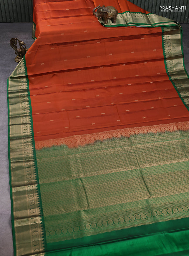 Pure kanchipuram silk saree rust shade and green with zari woven butttas and zari woven border