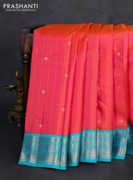 Pure kanchipuram silk saree dual shade of pinkish orange and teal blue with allover zari checks & buttas and zari woven korvai border