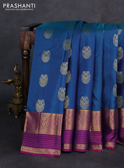 Pure kanchipuram silk saree peacock green and magenta pink with allover zari woven buttas and long zari woven korvai border