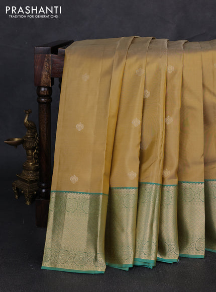 Pure kanchipuram silk saree sandal and light green with zari woven buttas and zari woven border