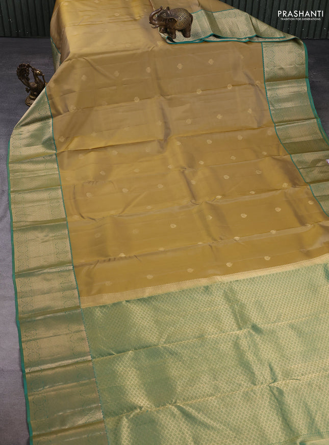 Pure kanchipuram silk saree sandal and light green with zari woven buttas and zari woven border
