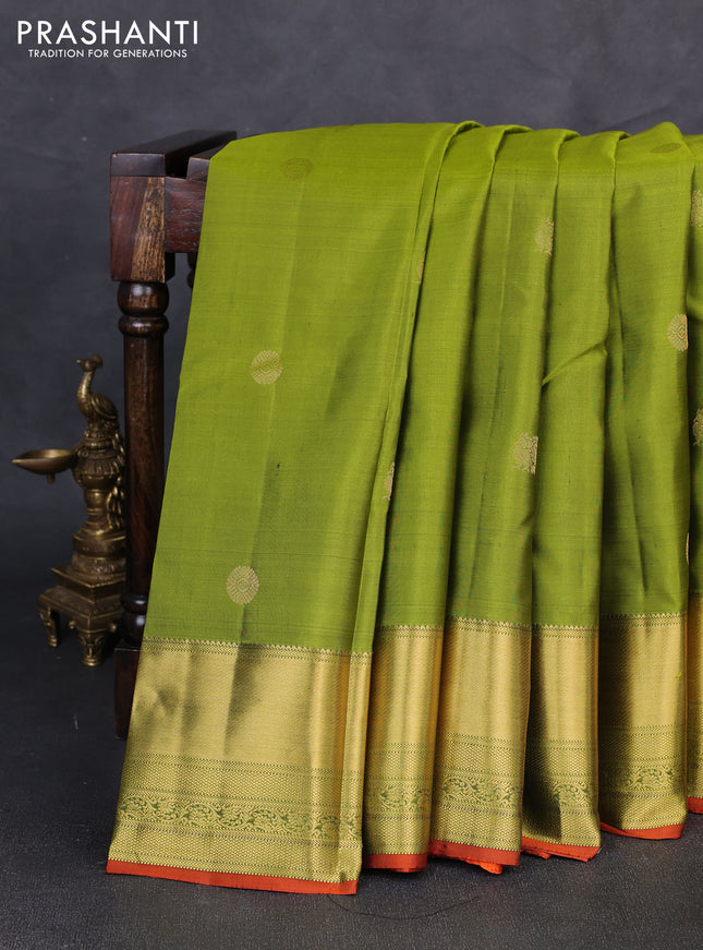 Pure kanchipuram silk saree light green and rust shade with zari woven buttas and zari rich zari woven border