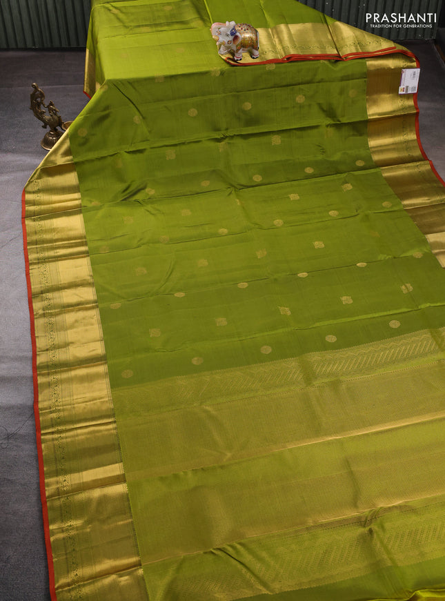 Pure kanchipuram silk saree light green and rust shade with zari woven buttas and zari rich zari woven border