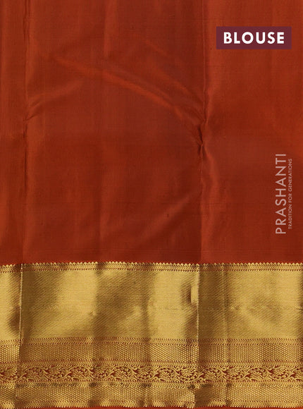 Pure kanchipuram silk saree light green and rust shade with zari woven buttas and zari rich zari woven border