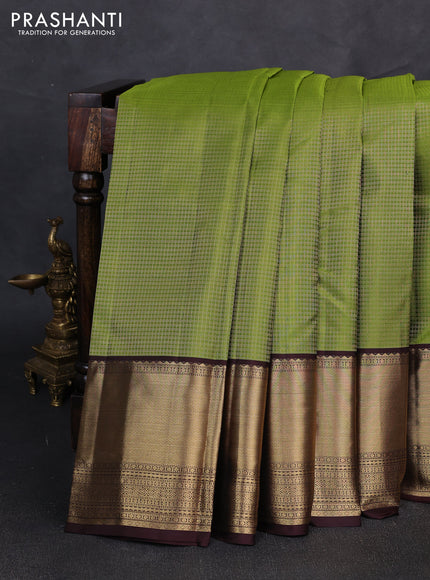 Pure kanchipuram silk saree light green and coffee brown with allover small zari checked pattern and long rich zari woven border