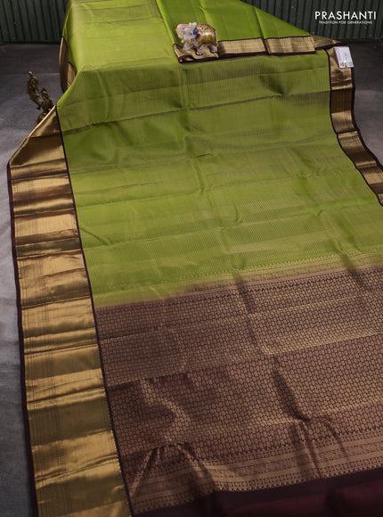 Pure kanchipuram silk saree light green and coffee brown with allover small zari checked pattern and long rich zari woven border