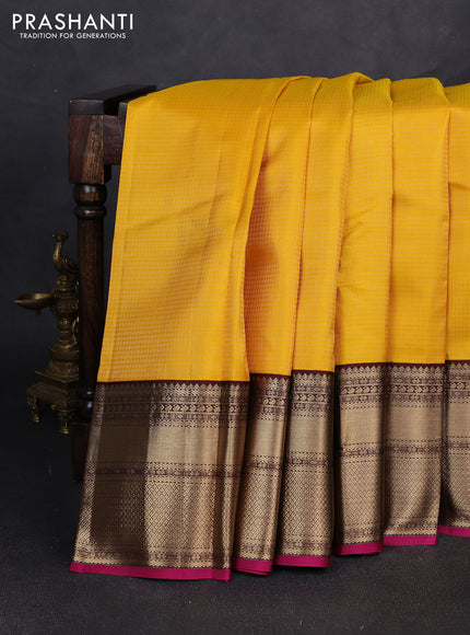 Pure kanchipuram silk saree yellow and magenta pink with allover small zari checked pattern and long zari woven korvai border