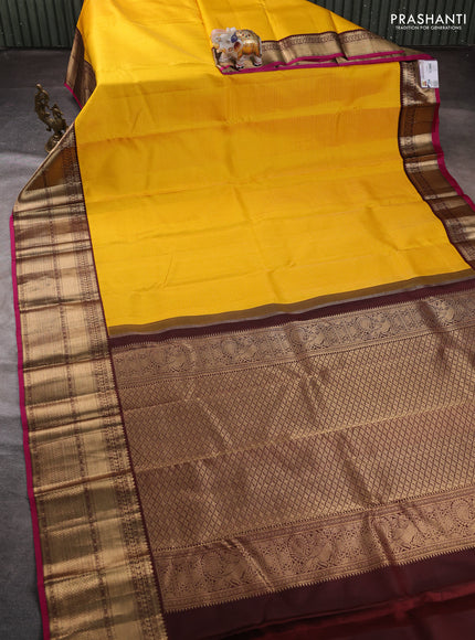 Pure kanchipuram silk saree yellow and magenta pink with allover small zari checked pattern and long zari woven korvai border