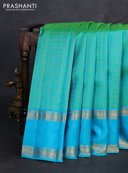 Pure kanchipuram silk saree teal green and teal blue with allover zari checked pattern and long rettapet zari woven border