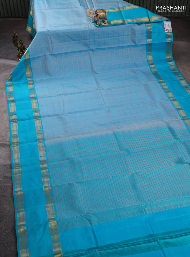 Pure kanchipuram silk saree pastel blue and teal blue with allover zari checked pattern and rettapet zari woven border