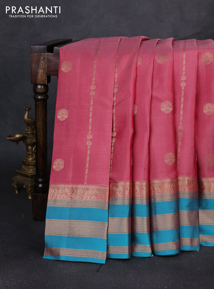 Pure kanchipuram silk saree peach pink and teal blue with allover zari weaves & buttas and long zari woven border