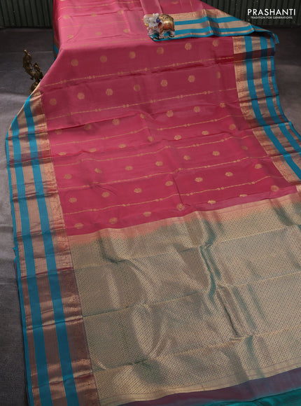 Pure kanchipuram silk saree peach pink and teal blue with allover zari weaves & buttas and long zari woven border