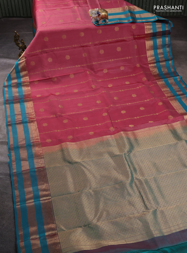 Pure kanchipuram silk saree peach pink and teal blue with allover zari weaves & buttas and long zari woven border