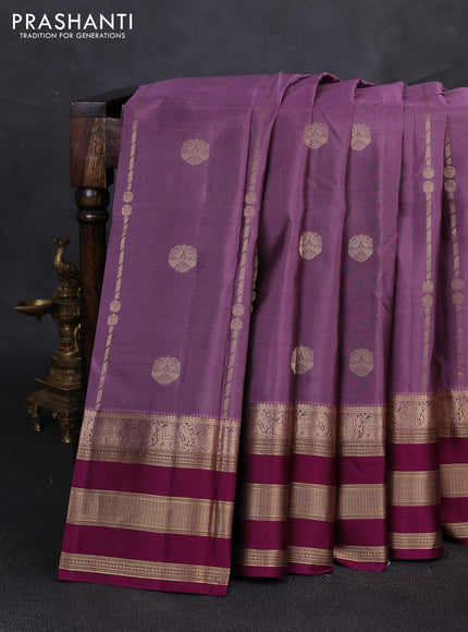 Pure kanchipuram silk saree pastel purple and purple with allover zari weaves & buttas and long zari wovemn border
