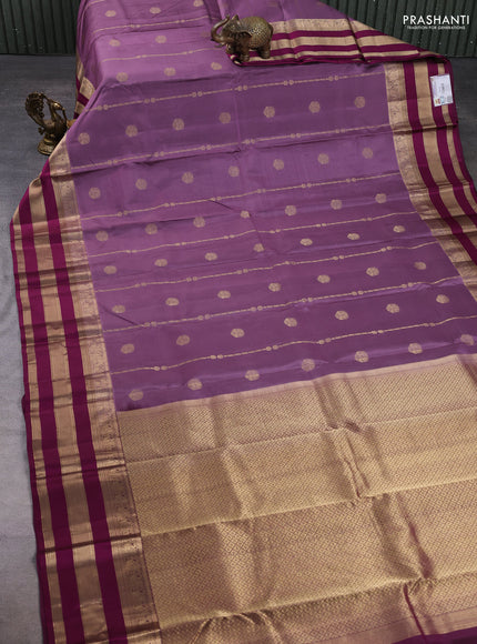 Pure kanchipuram silk saree pastel purple and purple with allover zari weaves & buttas and long zari wovemn border