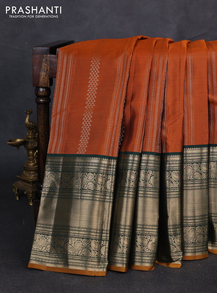 Pure kanchipuram silk saree rustic orange and green with allover zari weaves pattern and long zari woven border