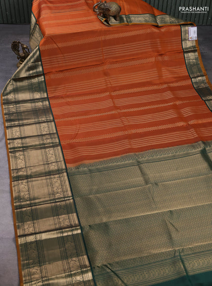 Pure kanchipuram silk saree rustic orange and green with allover zari weaves pattern and long zari woven border