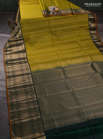Pure kanchipuram silk saree mehendi green and green with allover zari weaves pattern and long zari woven border