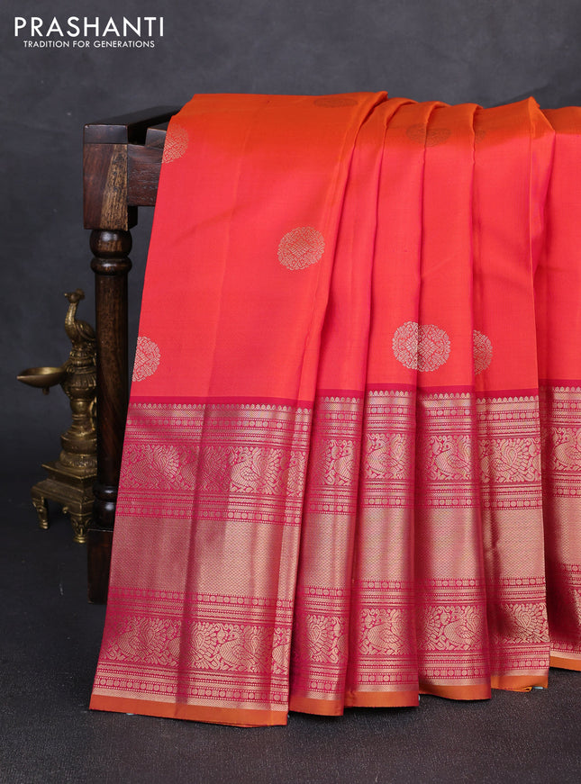 Pure kanchipuram silk saree dual shade of pinkish orange and maroon with allover zari rudraksha buttas and long zari woven border