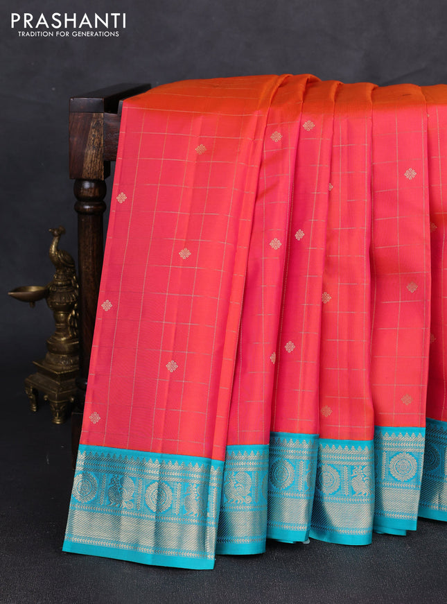 Pure kanchipuram silk saree peach orange and teal blue with allover zari checks & buttas and zari woven korvai border