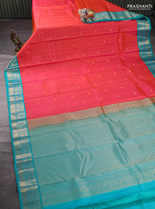 Pure kanchipuram silk saree peach orange and teal blue with allover zari checks & buttas and zari woven korvai border