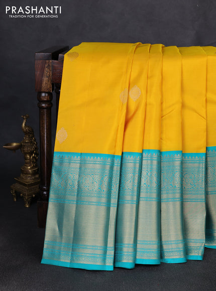 Pure kanchipuram silk saree yellow and teal green with zari woven buttas and long rich zari woven border