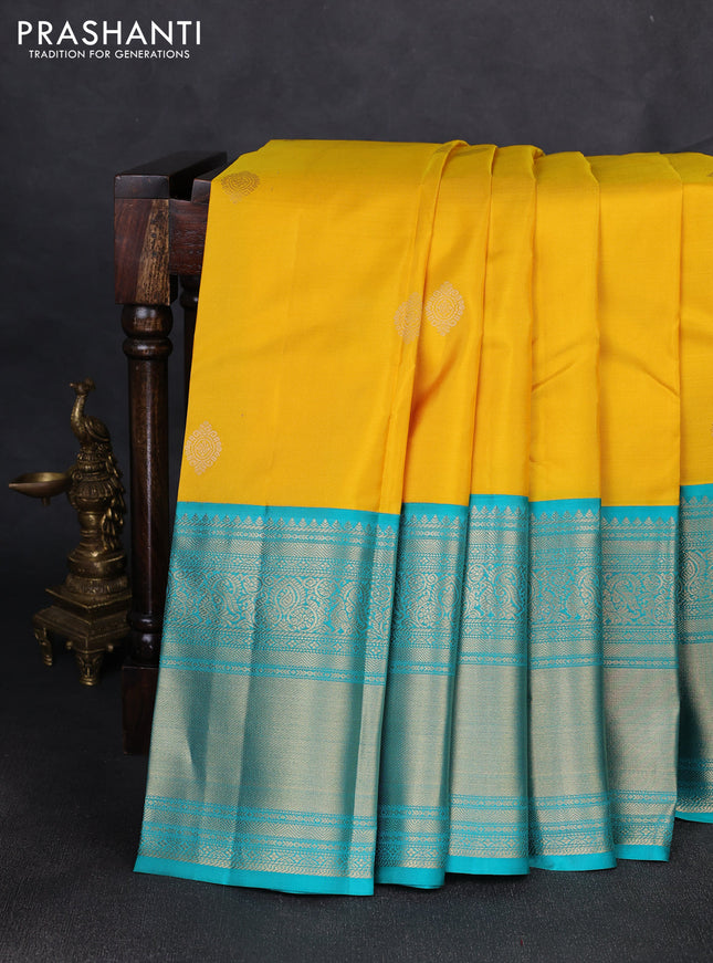 Pure kanchipuram silk saree yellow and teal green with zari woven buttas and long rich zari woven border