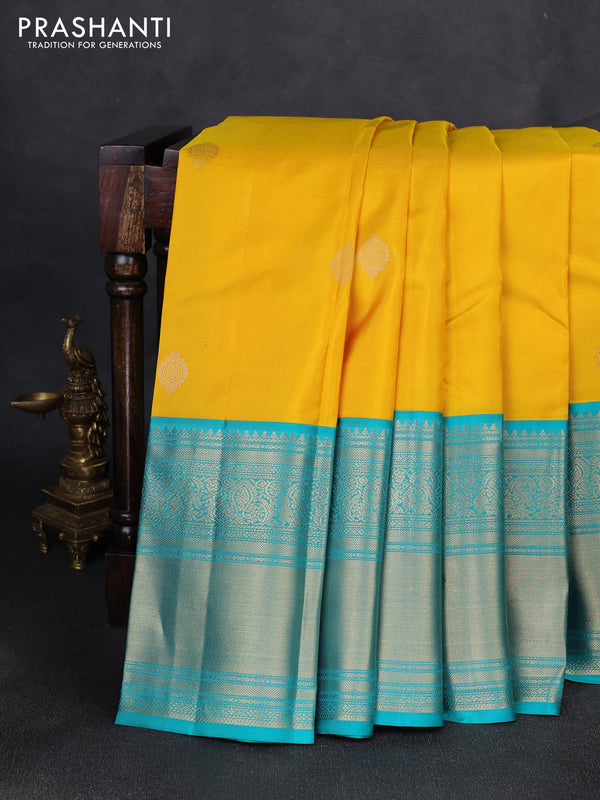 Pure kanchipuram silk saree yellow and teal green with zari woven buttas and long rich zari woven border