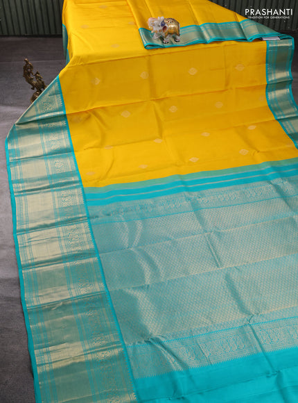 Pure kanchipuram silk saree yellow and teal green with zari woven buttas and long rich zari woven border