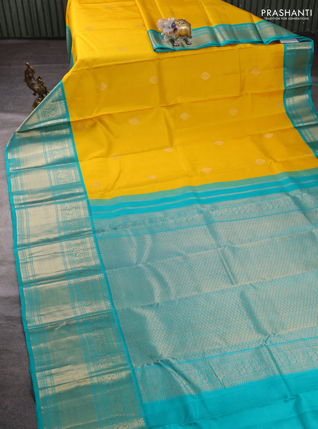 Pure kanchipuram silk saree yellow and teal green with zari woven buttas and long rich zari woven border