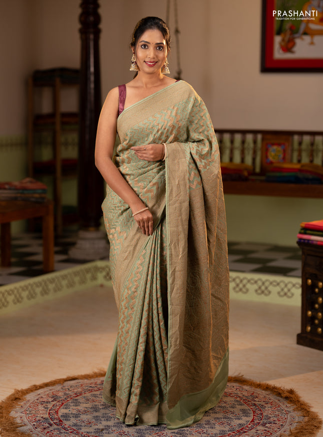 Banarasi crepe saree pista green with allover thread & zari zigzag weaves and woven border
