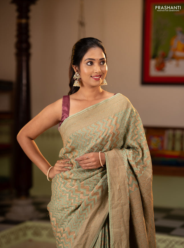 Banarasi crepe saree pista green with allover thread & zari zigzag weaves and woven border