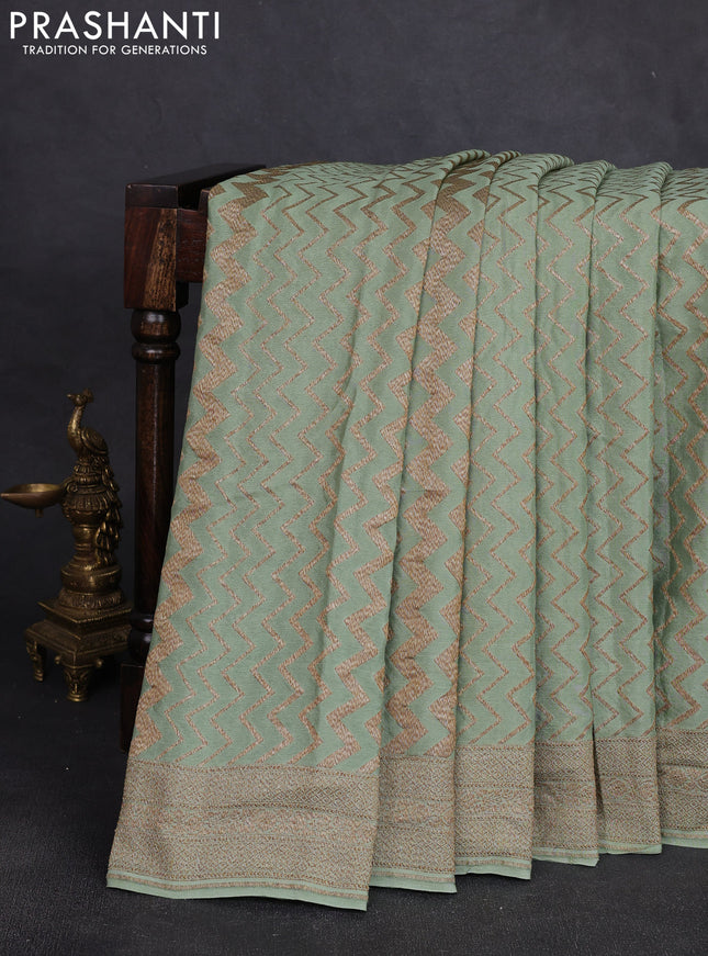 Banarasi crepe saree pista green with allover thread & zari zigzag weaves and woven border