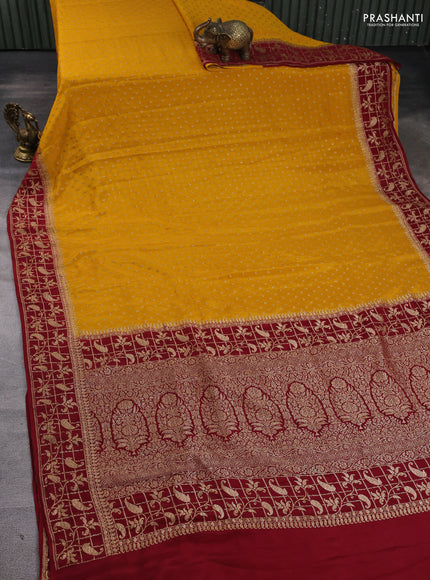 Banarasi crepe saree mustard yellow and maroon with allover thread & zari woven buttas and woven border