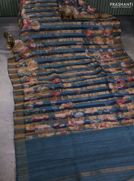 Organza tissue tussar silk saree peacock blue with allover zari stripe pattern & floral prints and zari woven border