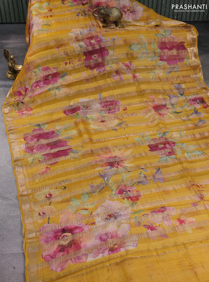 Organza tissue tussar silk saree mustard yellow with allover zari stripe pattern & floral prints and zari woven border