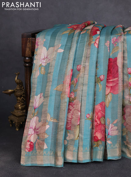Organza tissue tussar silk saree teal blue with allover zari stripe pattern & floral prints and zari woven border