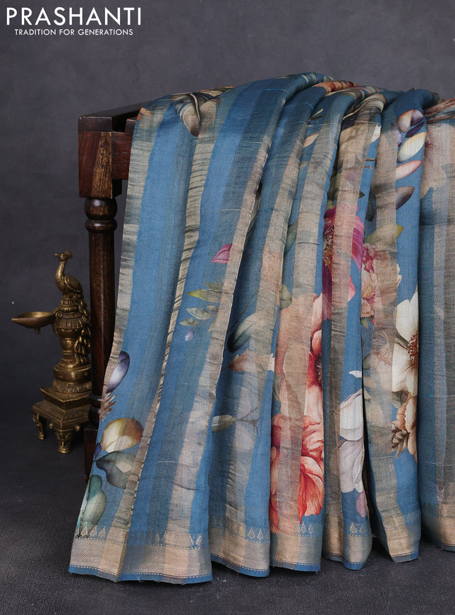 Organza tissue tussar silk saree cs blue with allover zari stripe pattern & floral prints and zari woven border